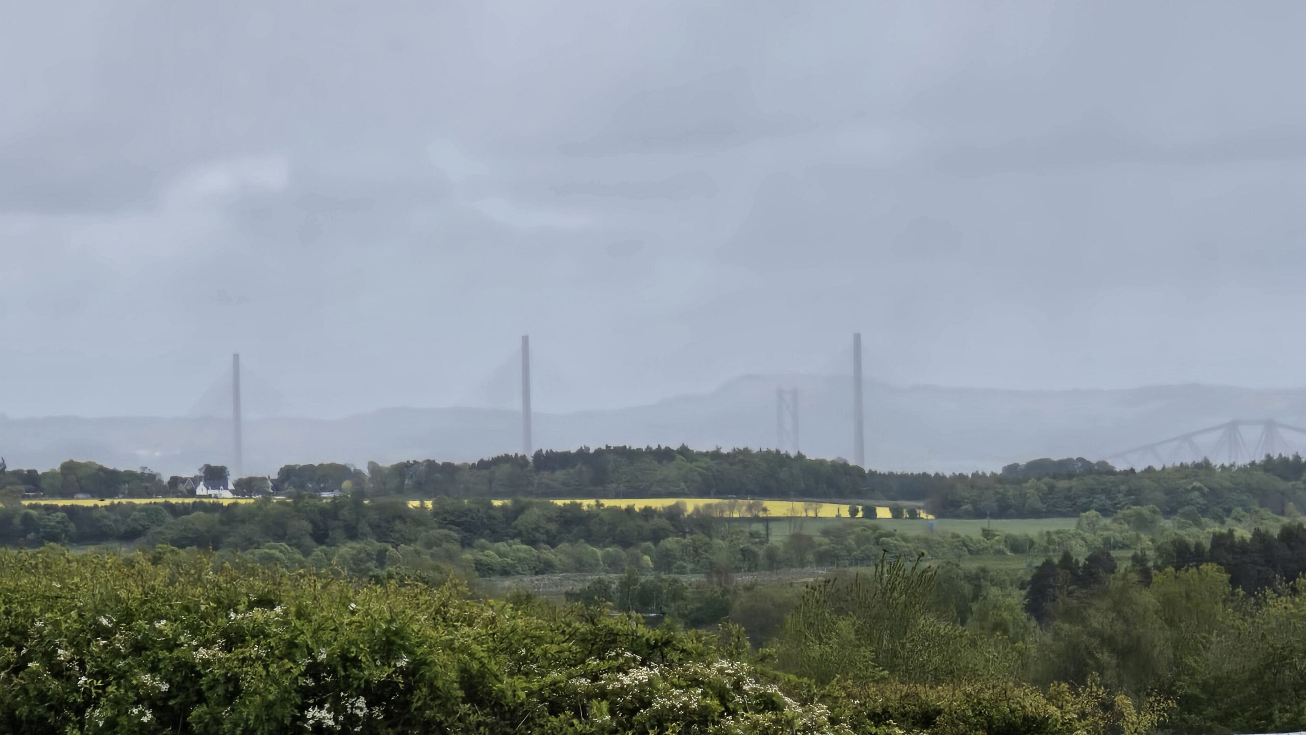 Mountains on the horizon, just visible through the grey